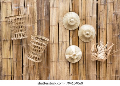 Bamboo wooden wall decoration with palm leaves hat and bamboo baskets background - Powered by Shutterstock