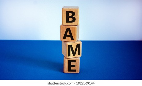 BAME Symbol. Abbreviation BAME, Black, Asian And Minority Ethnic On Wooden Cubes. Beautiful White And Blue Background. Copy Space. Business And BAME, Black, Asian And Minority Ethnic Concept.