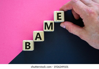 BAME Symbol. Abbreviation BAME, Black, Asian And Minority Ethnic On Wooden Cubes. Beautiful Purple And Black Background. Copy Space. Business And BAME, Black, Asian And Minority Ethnic Concept.