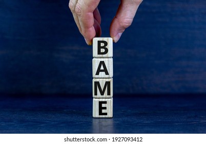 BAME symbol. Abbreviation BAME, black, asian and minority ethnic on wooden cubes. Beautiful grey background. Copy space. Business and BAME, black, asian and minority ethnic concept.