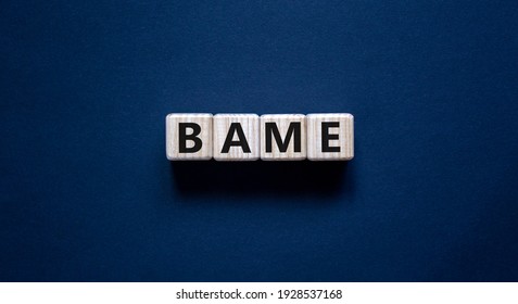 BAME Symbol. Abbreviation BAME, Black, Asian And Minority Ethnic On Wooden Cubes. Beautiful Grey Background. Copy Space. Business And BAME, Black, Asian And Minority Ethnic Concept.