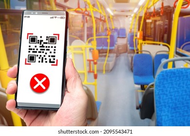 Ban on travel on public transport without QR codes. Smartphone with incorrect QR code on the background of an empty bus interior. Restrictions for unvaccinated people. Checking QR codes in transport
