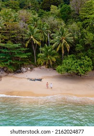 Banana Beach Phuket Thailand, Tropical Beach With Palm Trees In Phuket Thailand. Couple Man And Woman At Banana Beach Phuket