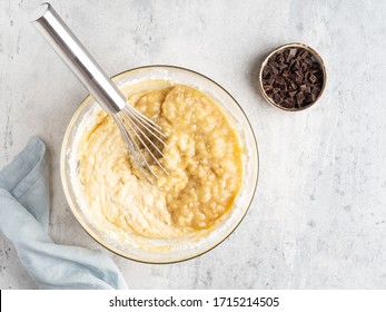 Banana bread or banana muffins (cake) step by step cooking process. Top view. Concrete background. Mixing all ingredients together, making dough or batter and filling metal baking form.  - Powered by Shutterstock