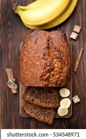 Banana Bread On Wooden Background, Top View