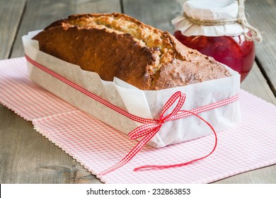 Banana Bread In Packaging Of Paper And Jar With Strawberry Jam