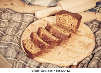 Banana bread sliced on plate - Shutterstock ID 585520412