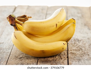 Banana Bunch On Wooden Background