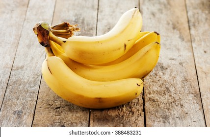 Banana Bunch On Wooden Background