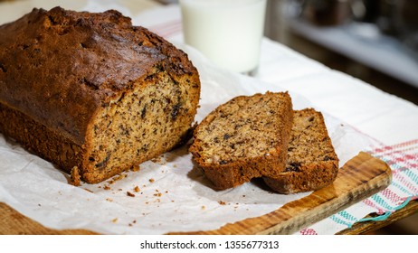Banana cake on a wooden background with a glass of milk - Shutterstock ID 1355677313