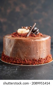 Banana And Chocolate Cake On A Dark Background. Vertical View. Close-up Celebration Cake. Story Format