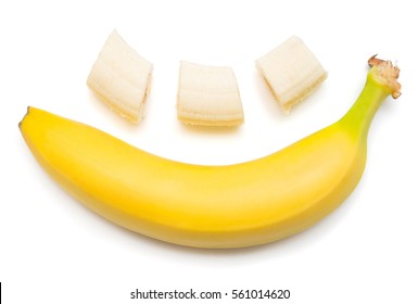 Banana Clown With A Slice Isolated On White Background. Flat Lay, Top View