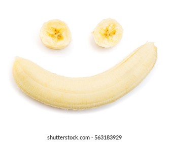 Banana Clown With A Slice Isolated On White Background. Flat Lay, Top View