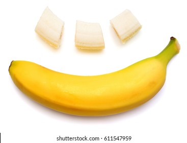 Banana Clown With A Slice Isolated On White Background. Flat Lay, Top View