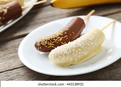 Banana Covered In Chocolate On A Grey Wooden Table