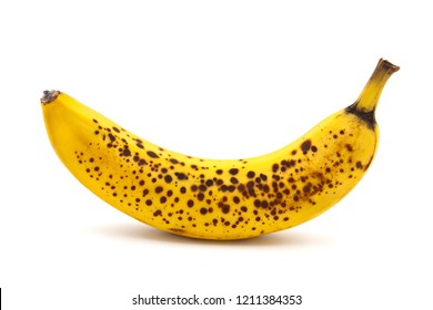 Banana with dark spots with shadow isolated on white background. Closeup, selective focus