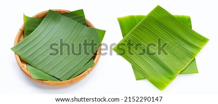 Banana leaves in bamboo plate on white background.