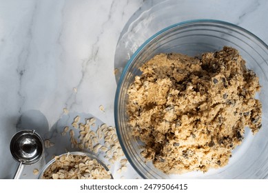 banana oatmeal chocolate chip cookies dough in a glass bowl. - Powered by Shutterstock