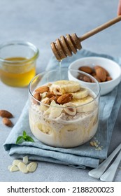 Banana overnight oats with  nuts and honey glass jar, healthy breakfast - Shutterstock ID 2188200023