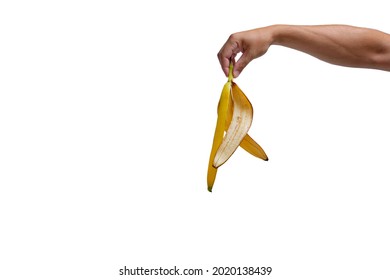 Banana peel in hand on white background, isolate