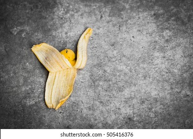 Banana Peel On The Ground With Space For Text, Walk Carefully Concept.