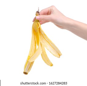 Banana skin in hand on white background isolation