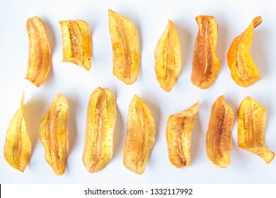 banana slice chips top view on white background.