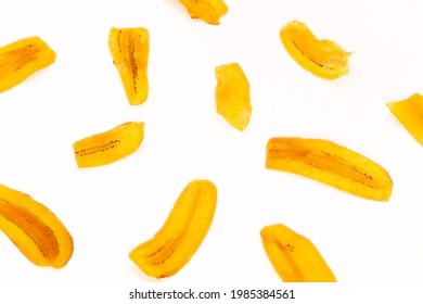 banana slice chips top view on white background.
