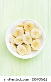 Banana slices in bowl, top view