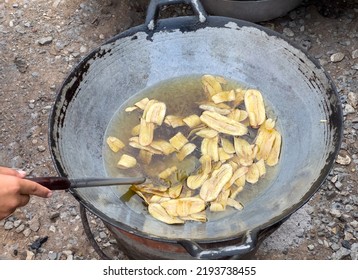 The Banana Slices Are Fried In Hot Vegetable Oil For Making Banana Chips In The Traditional Thai Style, Above View With The Copy Space.