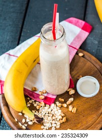 Banana Smoothie With Oat Flakes And Milk In The Bottle, Breakfast,top View