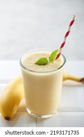 Banana smoothie on a white background - Shutterstock ID 2193171735