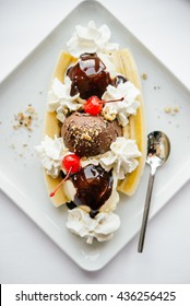 Banana Split Ice Cream Served On White Plate