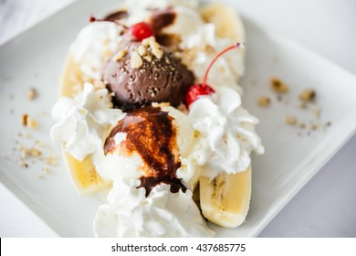 Banana Split Ice Cream Served On White Plate