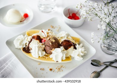 Banana Split Ice Cream Served On White Plate