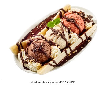Banana split sundae ice cream in a bowl with strawberry and raspberry vanilla icecream scoops on white background isolated, overhead view