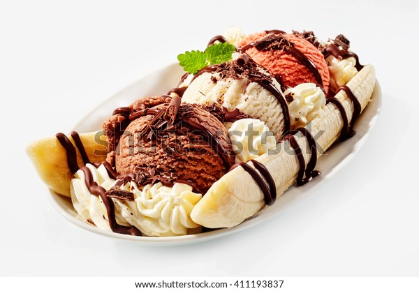 Banana split sundae ice cream in\
a bowl with strawberry and raspberry vanilla icecream\
scoops