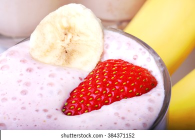 Banana And Strawberry Smoothie On White Background