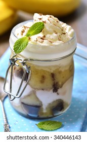 Banana Trifle With Chocolate Sauce In A Jar.