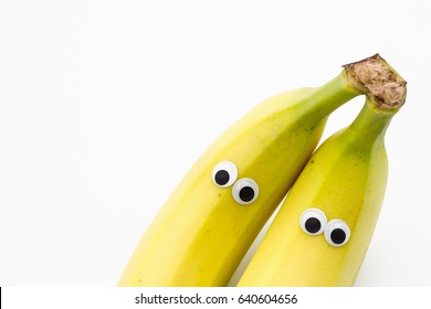 bananas with googly eyes on white background - banana face