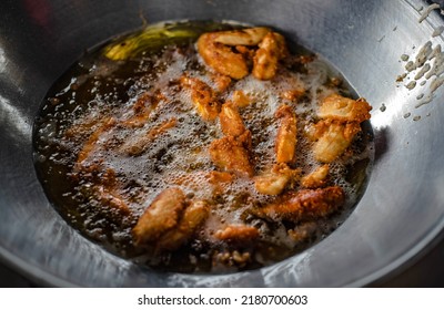 Bananas And Sweet Potatoes Are Battered And Fried In A Hot Oil Pan.