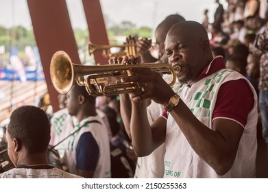 A Band Member Blowing The Trumpet During A Football Game At The Nigerian University Games At The University Of Lagos - Lagos, NIGERIA, March 22 2022.