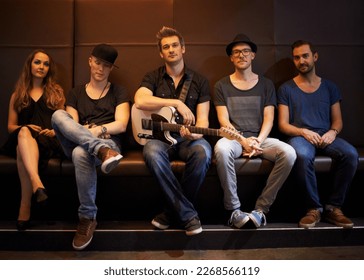 A band posing for a photo before a big show. This concert was created for the sole purpose of this photo shoot, featuring 300 models and 3 live bands. All people in this shoot are model released. - Powered by Shutterstock