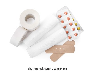 Bandage Rolls And Medical Supplies On White Background, Top View