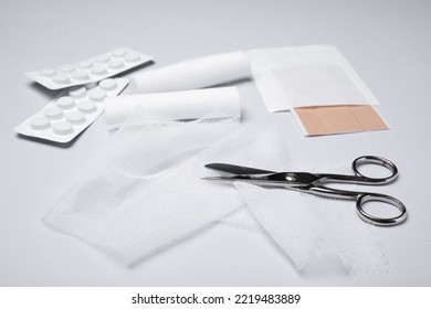 Bandage Rolls And Medical Supplies On White Background