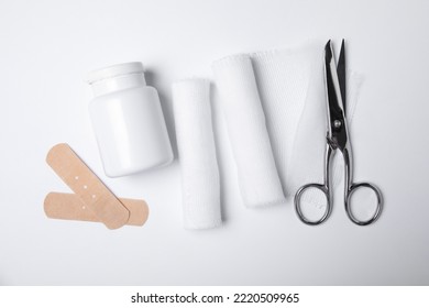 Bandage Rolls And Medical Supplies On White Background, Flat Lay