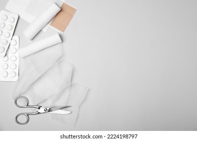 Bandage Rolls And Medical Supplies On White Background, Flat Lay. Space For Text