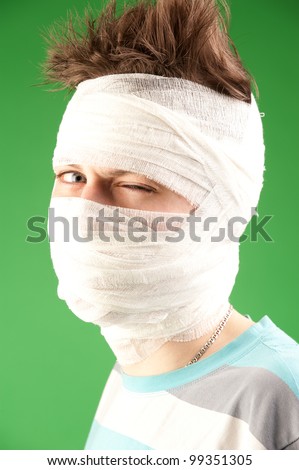bandaged face in bandages, this picture come to different topics. teenage acne, cosmetic surgery, accident and other