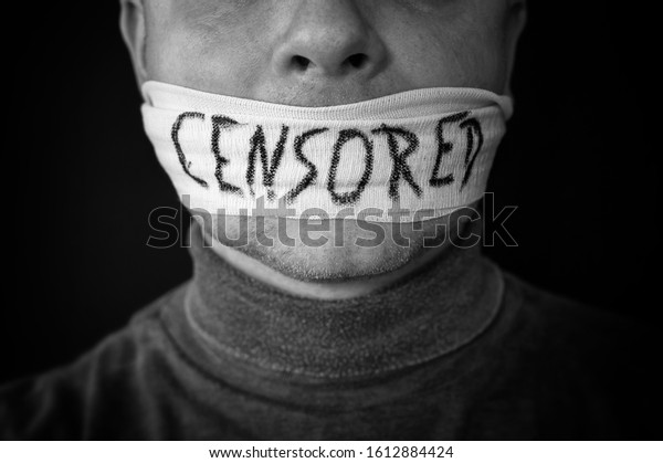 Bandaged\
mouth of a man with the word censored in\
English
