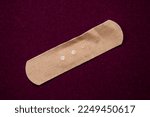 Band-aid isolated on color background. Top view photo of band aid with copy space.